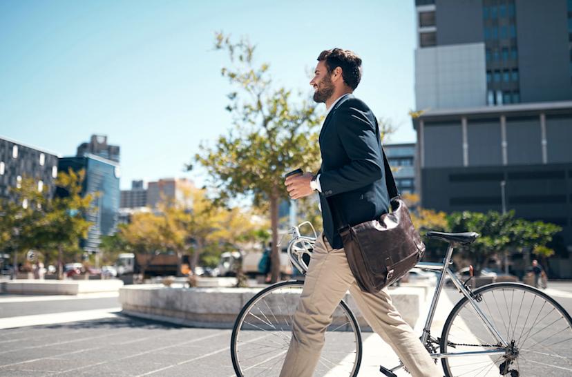 Worker on way to work with bicycle