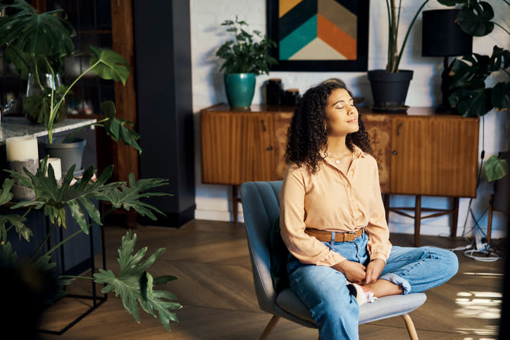 Woman seated taking a breath