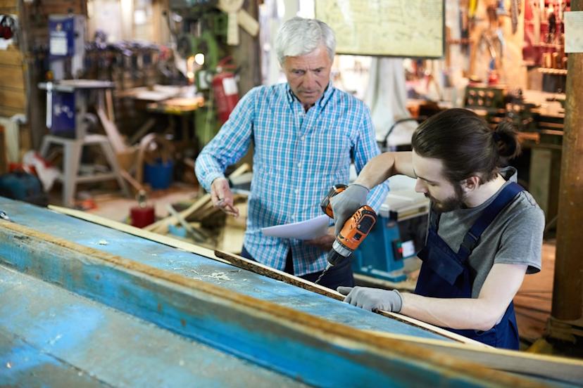 Mentor working with a young employee