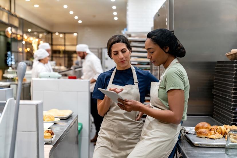 Manager onboarding a new employee at a bakery