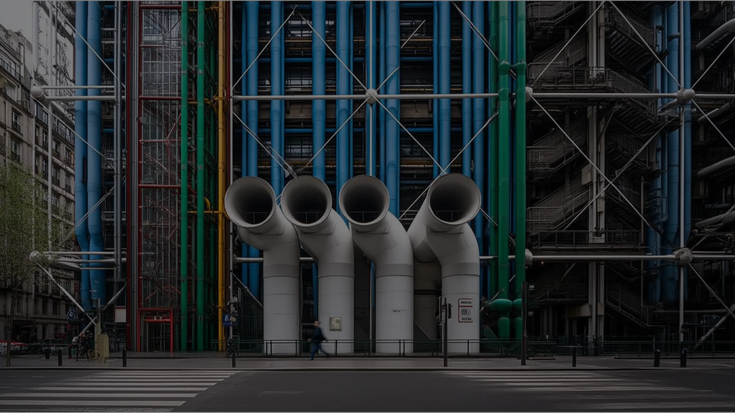 Exterior facade of the Centre Pompidou in Paris with large white, blue and green industrial pipes and a pedestrian crossing in the foreground.
