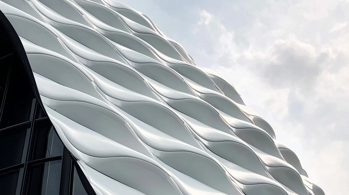 Close-up detail of the white, wavy honeycomb facade of The Broad museum in Los Angeles.