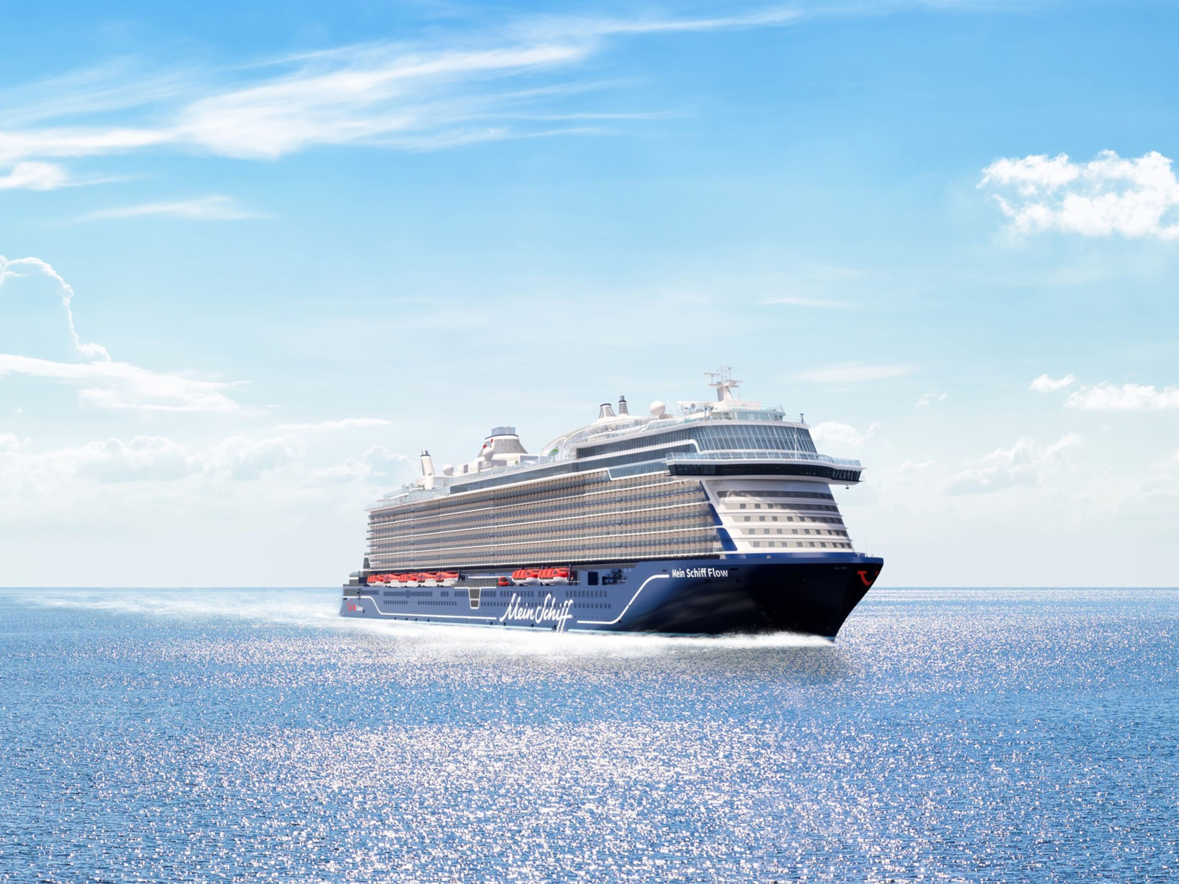 Kreuzfahrtschiff der Mein Schiff® Flotte auf offenem Meer unter blauem Himmel. Kreuzfahrtschiff der Mein Schiff® Flotte auf offenem Meer unter blauem Himmel.