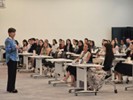 A picture of Cara addressing the audience at the SgIC