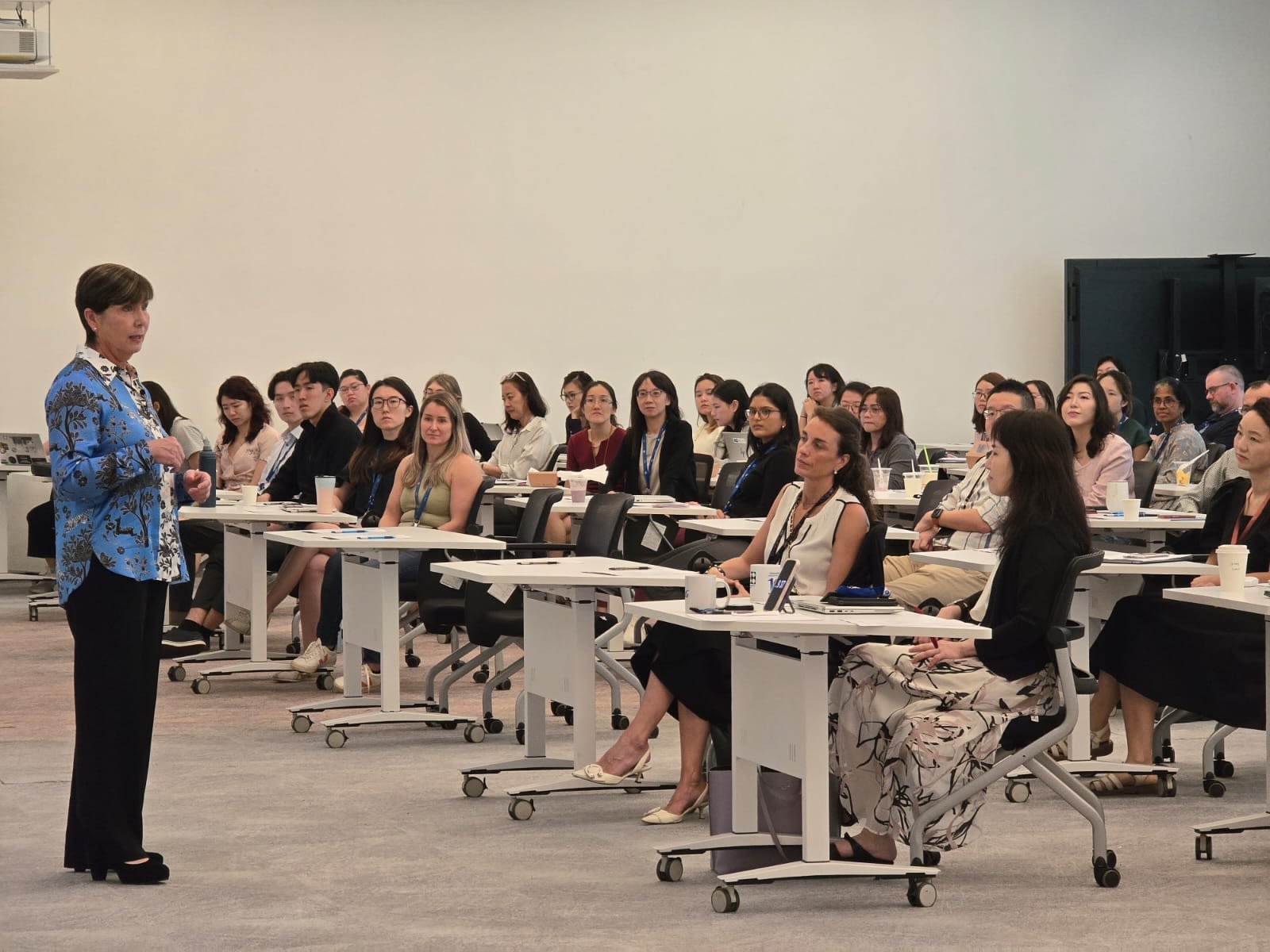 A picture of Cara addressing the audience at the SgIC
