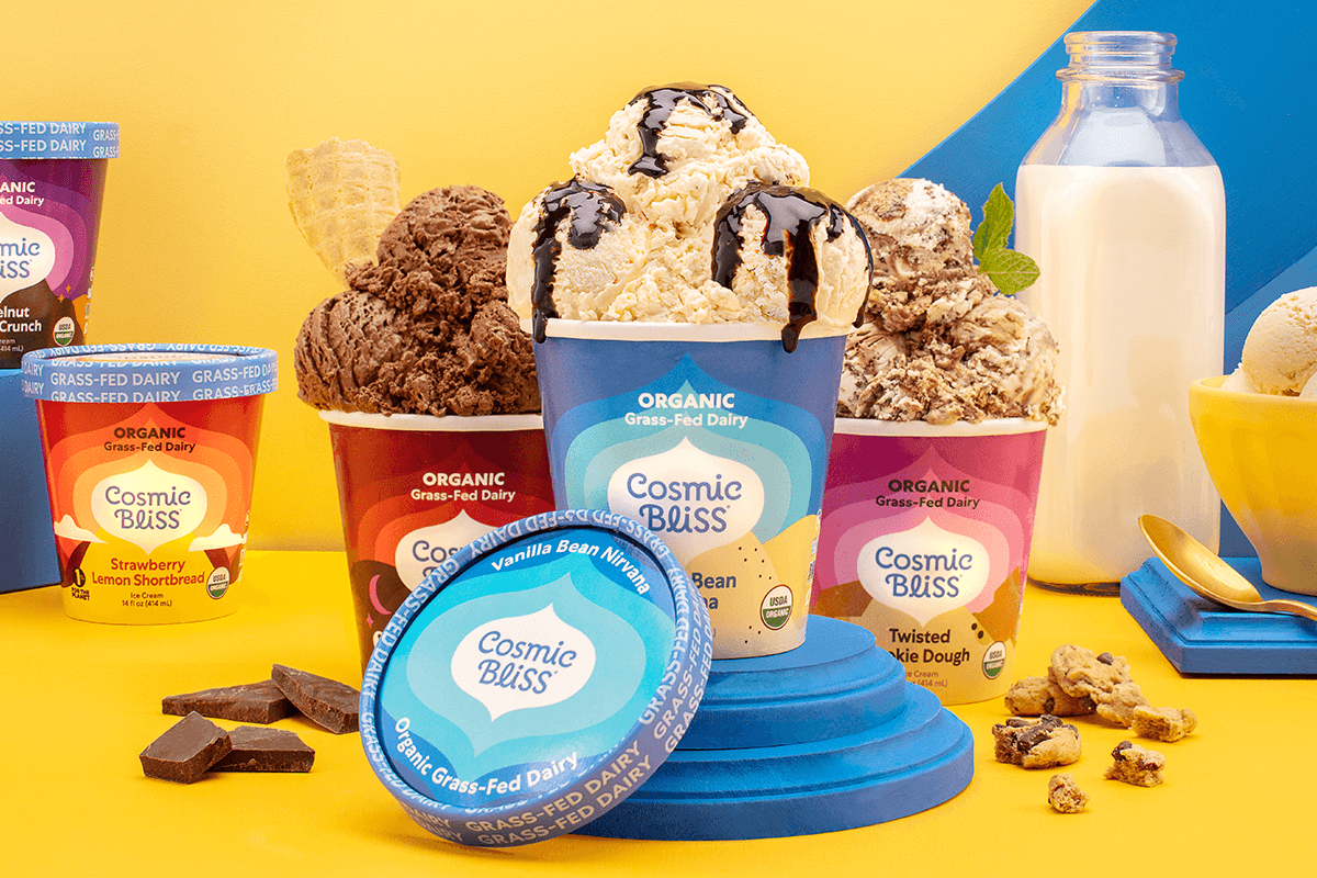 A selection of grass-fed dairy ice cream pints open with ice cream scoops on top