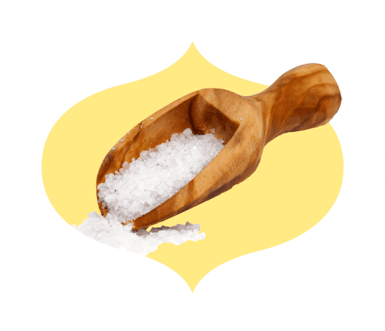 Sea salt in a wooden scoop within a bindi frame