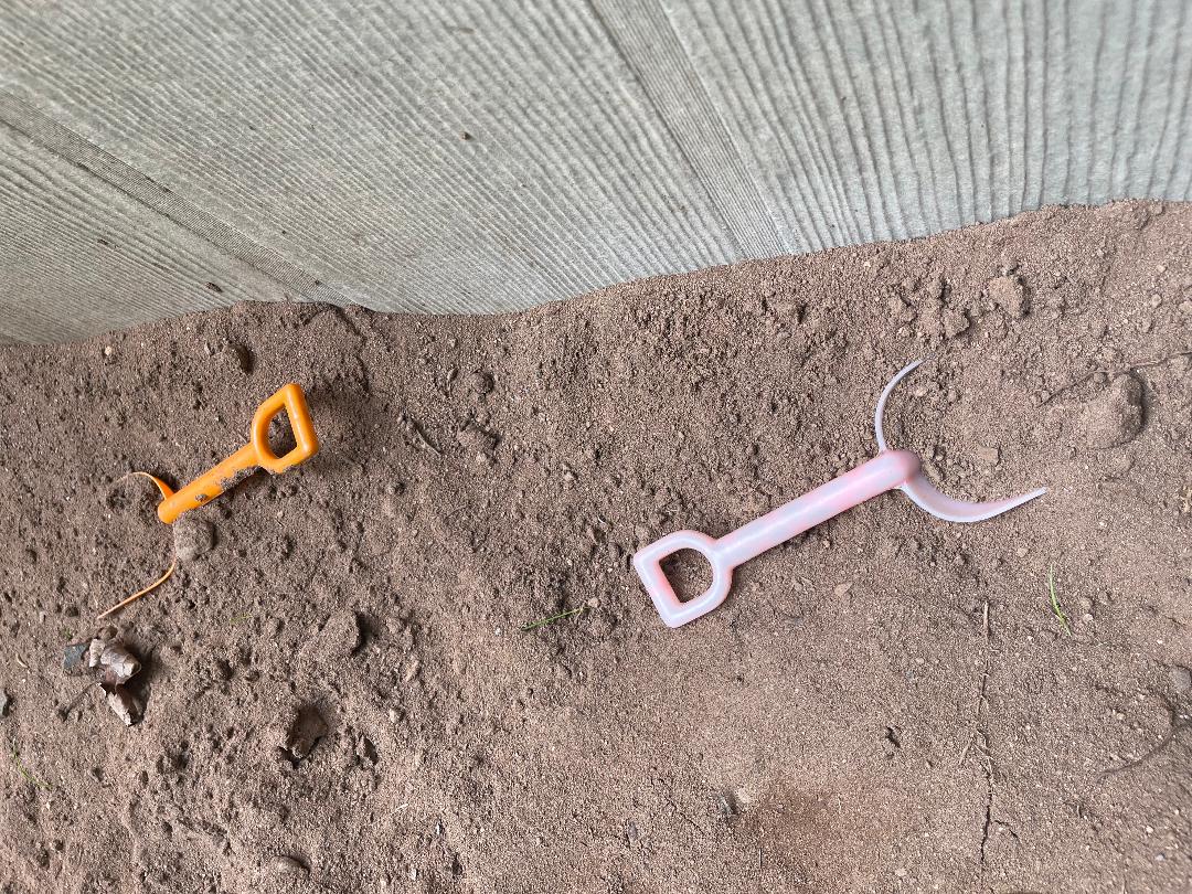 Small shovels in sandbox