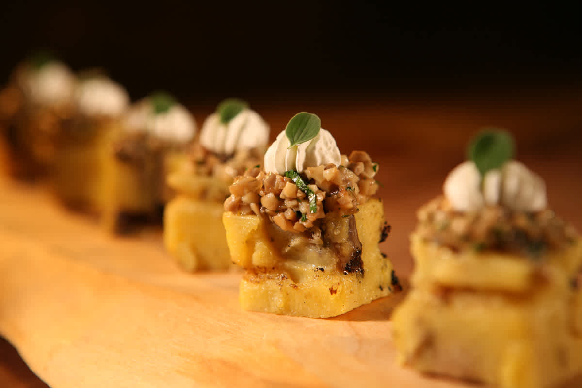 A line of desserts with whipped topping.