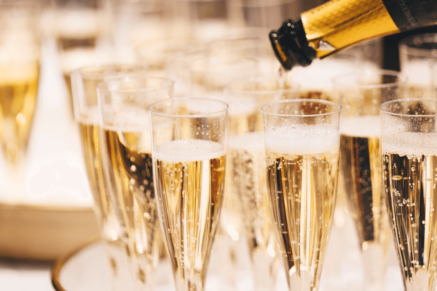 A collection of champagne glasses outside on the outdoor terrace featured at the Prince room at Paradise Banquet Halls.