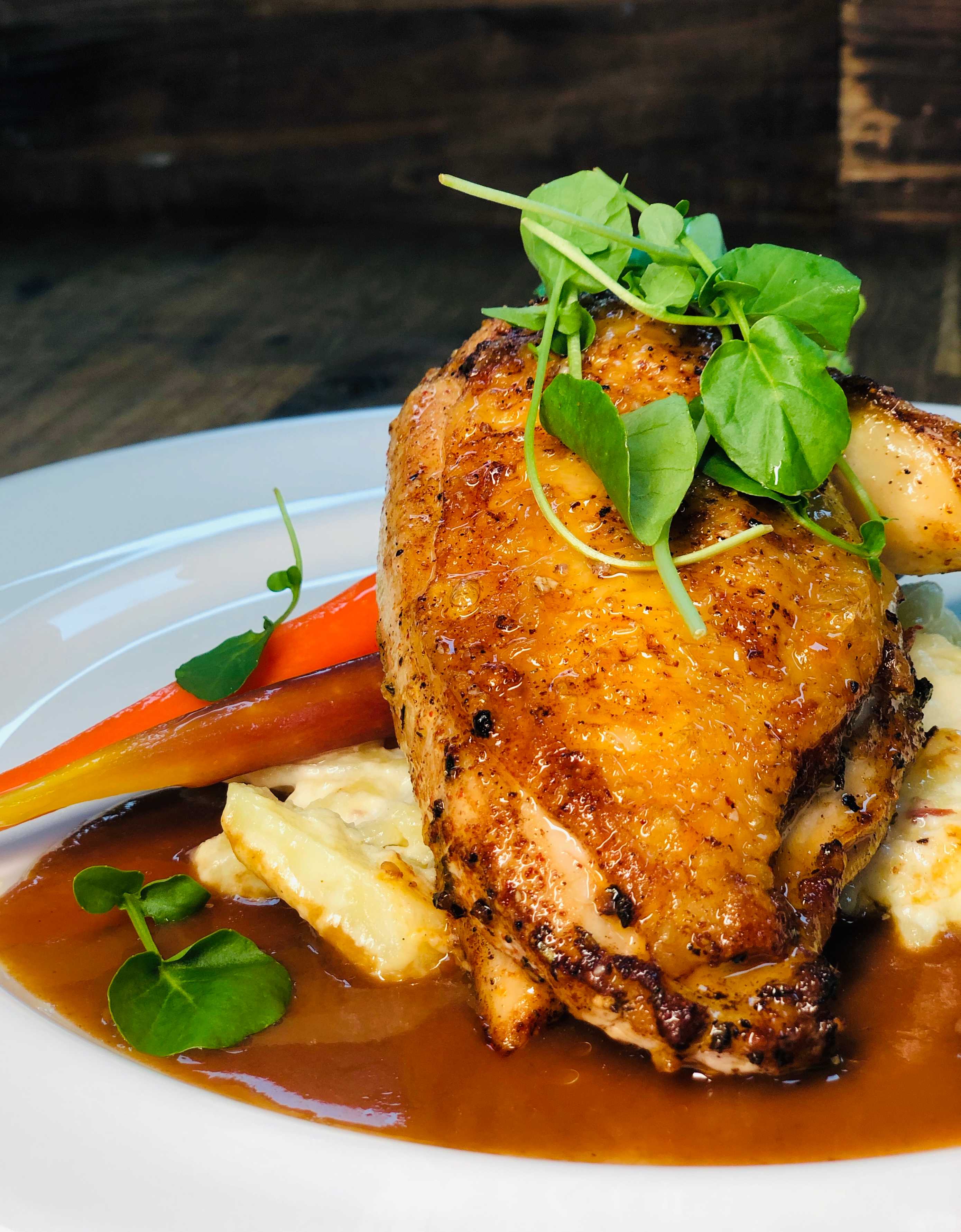 A meat dish with vegetable garnish.