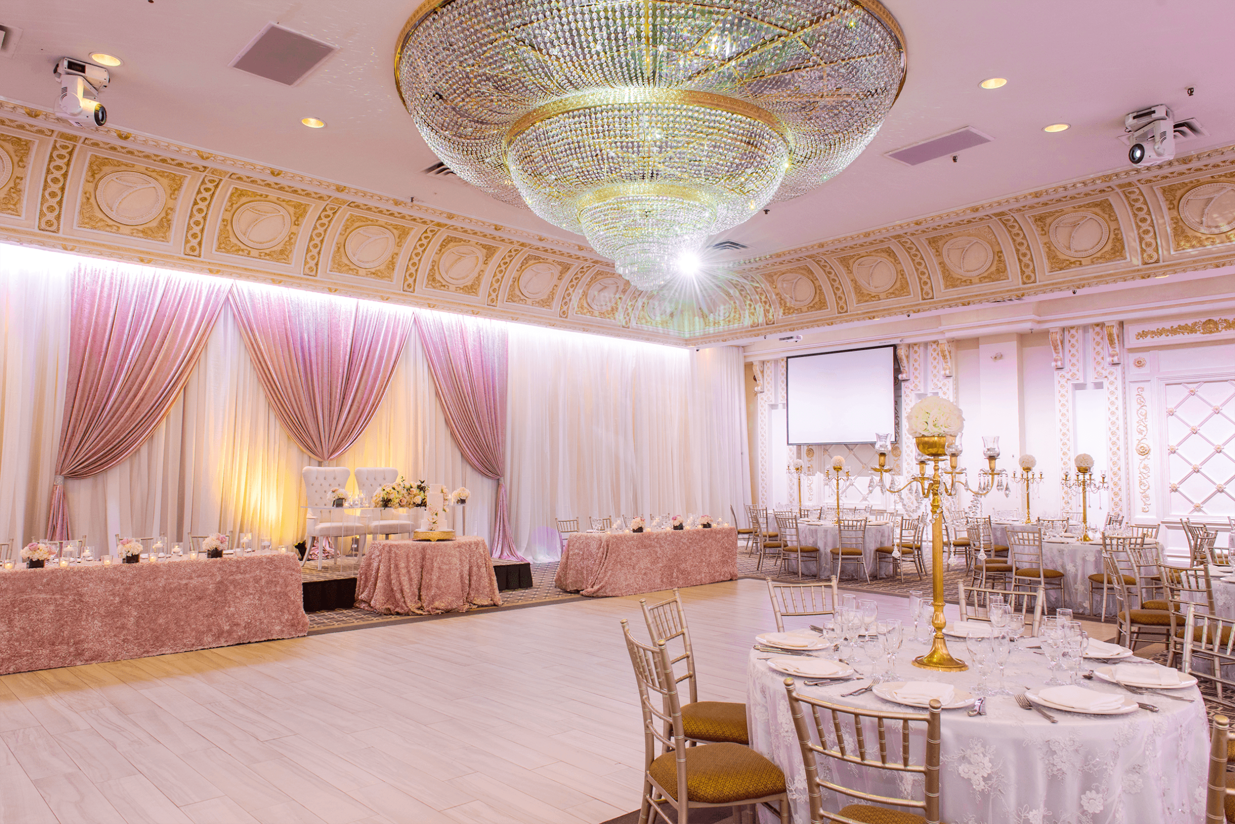 The Queen Victoria venue at Paradise Banquet Halls with a large dance floor, tables and chairs, and a head table.