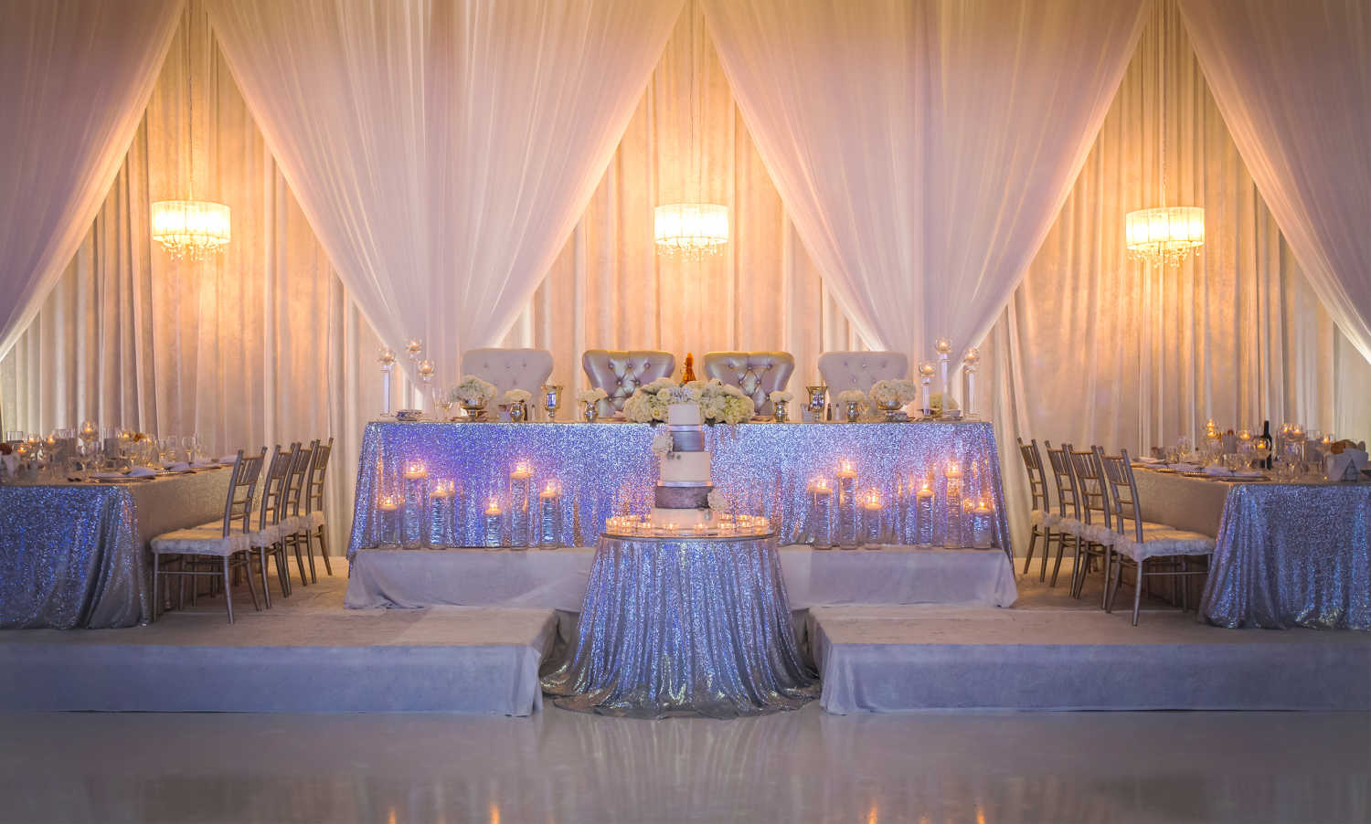 The head table for a wedding hosted at The Three Queens (Grand Queens) venue at Paradise Banquet Halls.