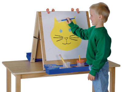 Children's Tabletop Easel - Double sided Easel on table with one child painting picture
