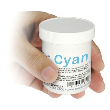 Open in modal - Smooth-On Silc Pig Silicone Color Pigments - Hand holding Single jar of Cyan Pigment shown