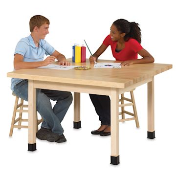 Open in modal - Diversified Spaces Four-Student Tables - Two seated students painting at Maple top Table
