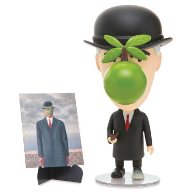 Art History Heroes Figurine - Rene Magritte figurine standing next to his artwork