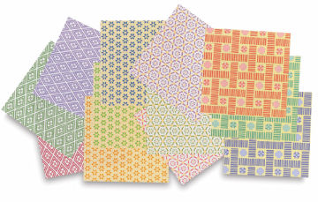 Aitoh Komon Print Chiyogami Paper - Several sheets of package of 48 shown scattered in pile
