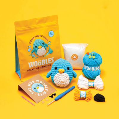 The Woobles Beginner Crochet Amigurumi Kits - Penguin (kit contents with finished project and packaging)