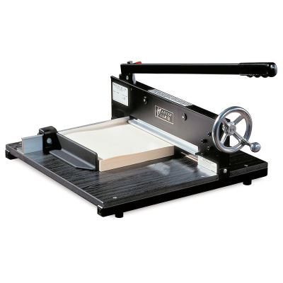 Commercial Stack Cutter - Angled view with blade slightly raised and clamp holding paper stack