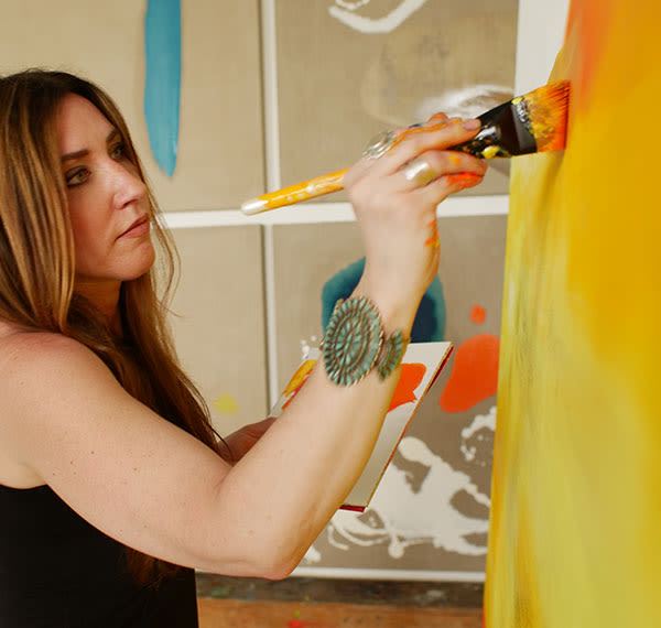 MIa Tarducci painting in her studio
