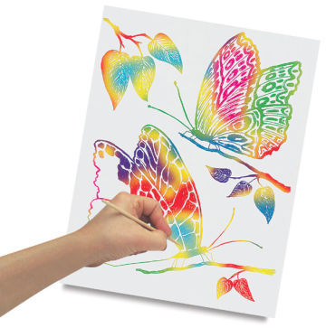 Scratch-Art Colored Papers - Child's hand scratching white paper to make rainbow butterflies