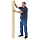 Blick Unprimed Cotton Canvas - Medium Weight, Medium-Smooth Texture, 72" x 25 yds, man standing next to canvas
