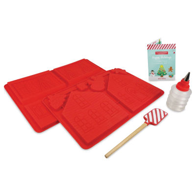 Handstand Kitchen Make Your Own Gingerbread House, laid out bakeware utensils and recipe booklet. 