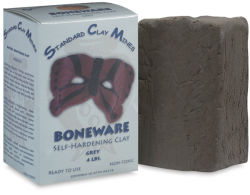 Sculpture House Boneware Moist Clay - Angled view of package standing next to block of Gray clay
