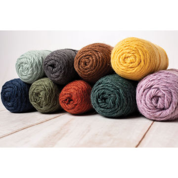 Lion Brand Re-Spun Yarn, rolls on top of each other