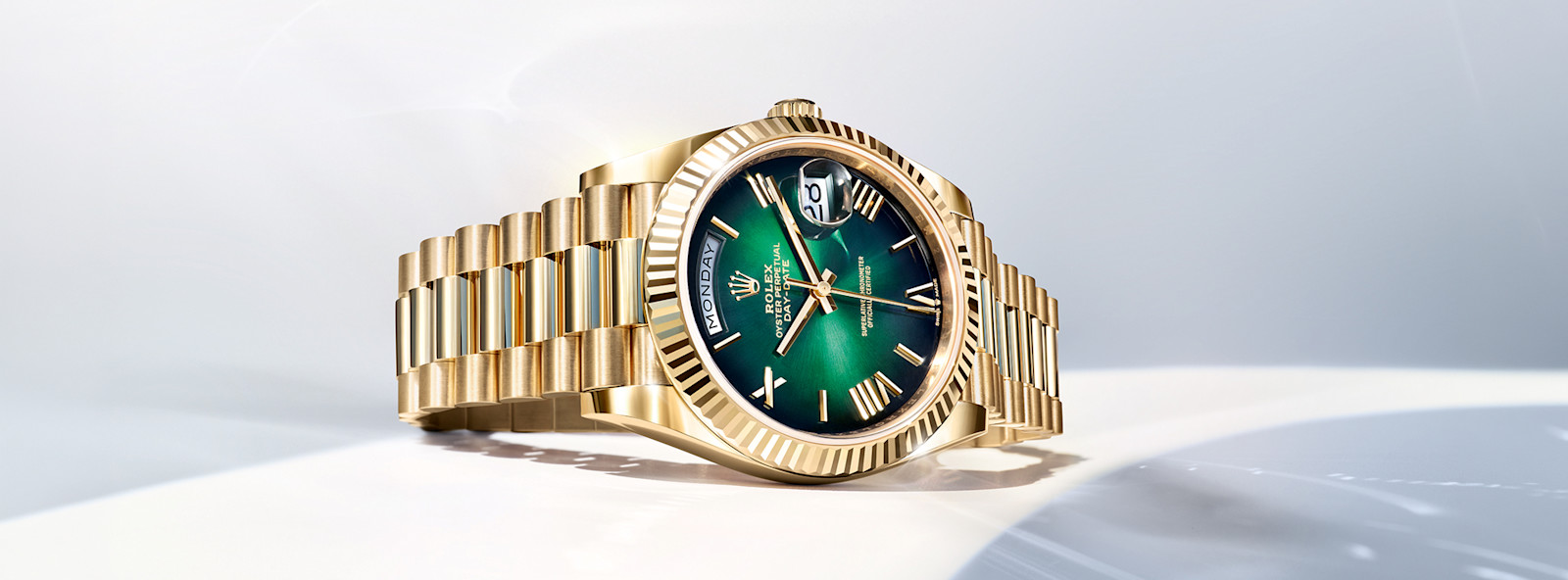 Rolex Day-Date 40 in yellow gold with green dial