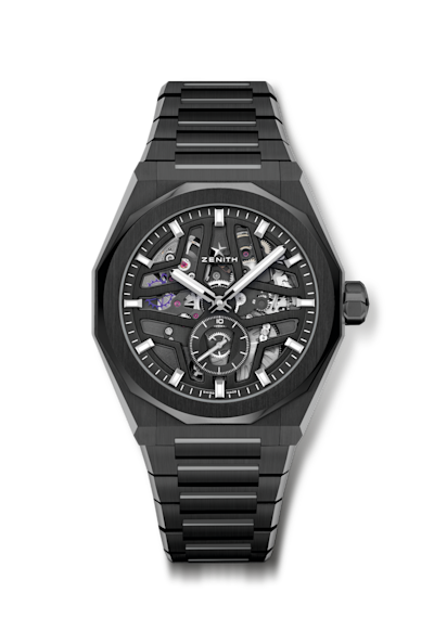 A stylish wristwatch featuring a deep blue dial with silver and orange accents. The blue fabric strap complements the watch face, which displays time with bold, luminescent hands and markers. The watch is water-resistant up to 500 meters.