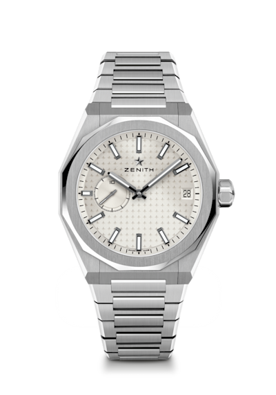 A stainless steel wristwatch with a blue textured dial, silver hour markers, and hands. The brand name "Zenith" is displayed under the 12 o'clock position, and a small date window is present at the 3 o'clock position.