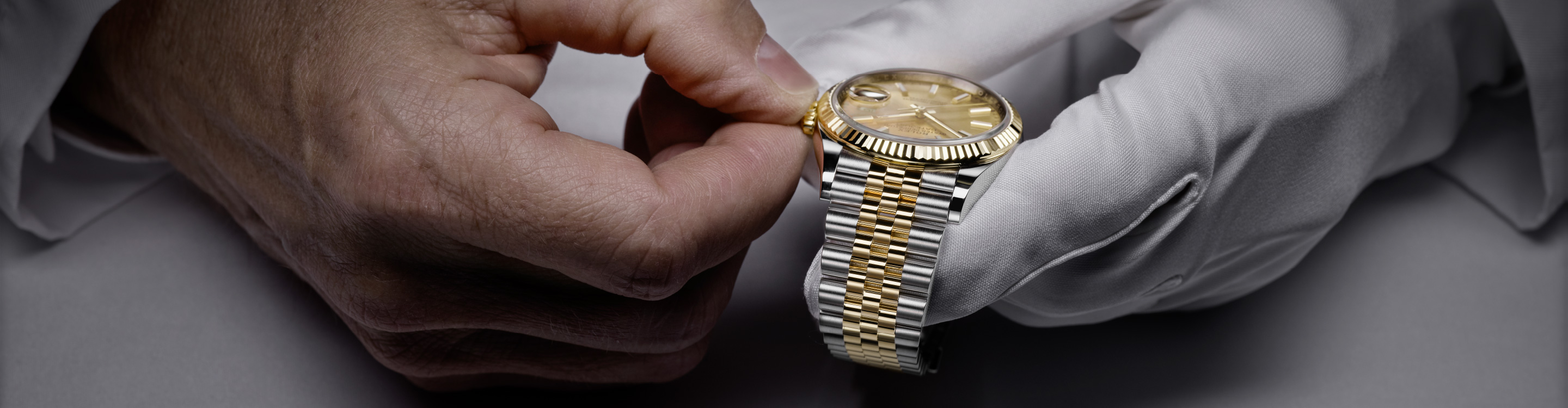 Finely servicing a gold and silver Rolex watch