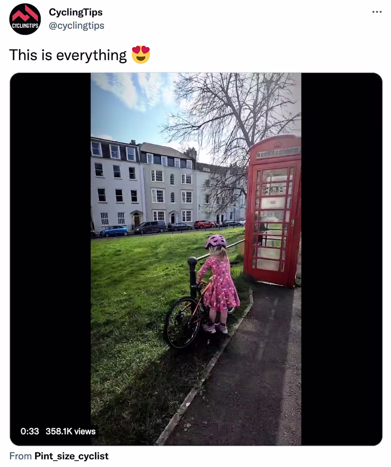 A girl entering a phone booth