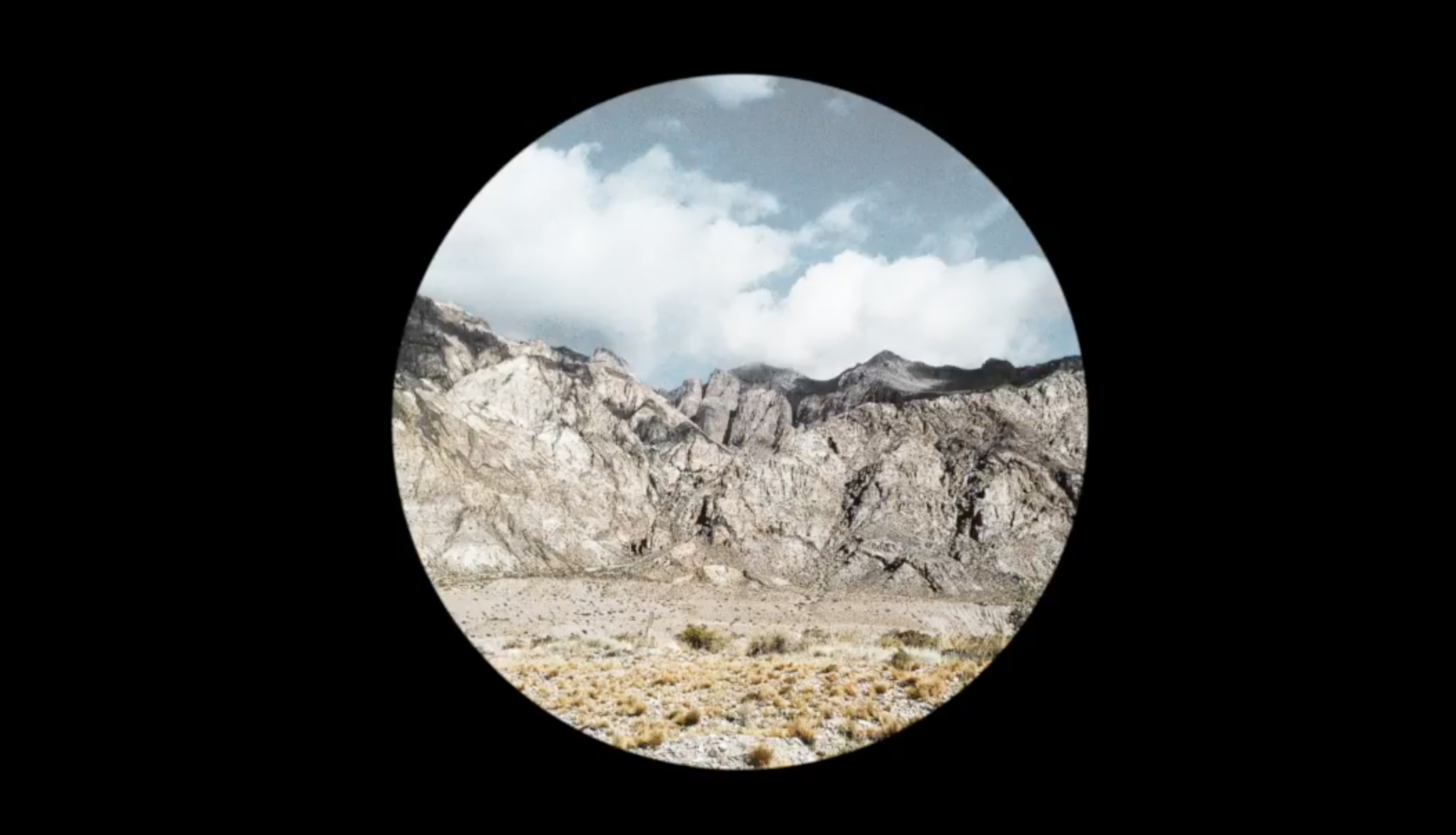 Cover of "Glass Museum - Electric Silence (Official audio)" showing hills cut out in a circle.