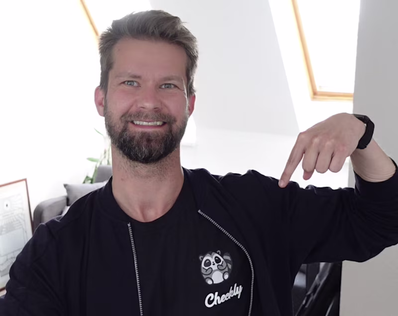 Stefan wearing a checkly shirt.