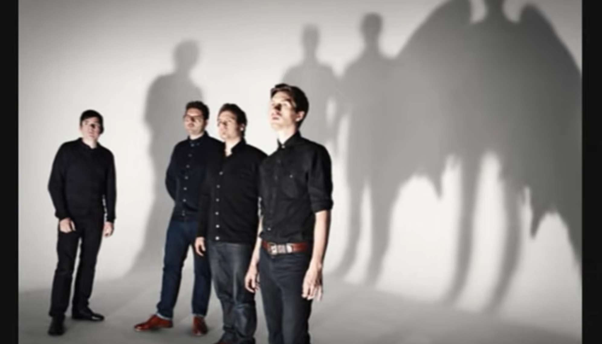 Athlete cover for chances showing the band standing in front of a white wall.