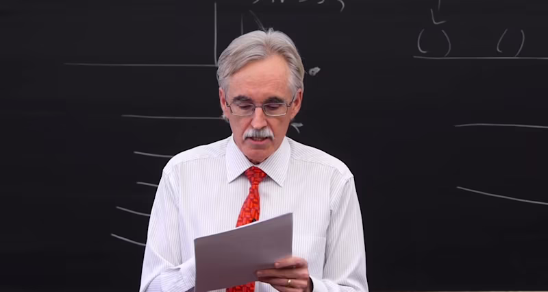Larry McEnerney teaching with a piece of paper in his hand