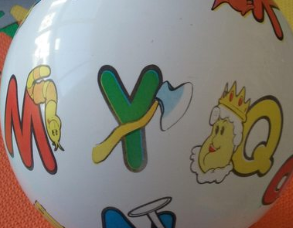 A ball showing the letter "Y" next to a symbol that looks like an axe.