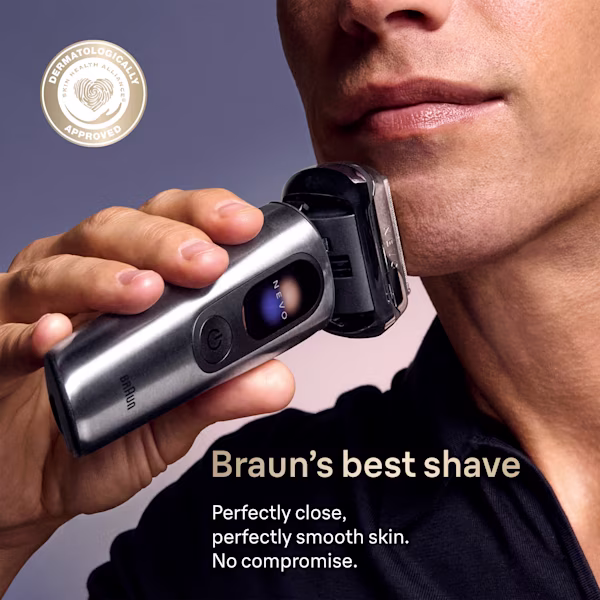 Man shaving his chin with Braun NEVO shaver, "dermatology approved" badge shown Man shaving his chin with Braun NEVO shaver, "dermatology approved" badge shown