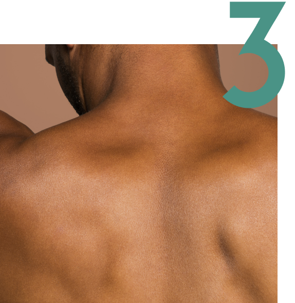 Person's bare back with the number three