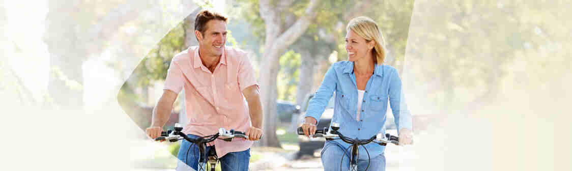 Couple happily biking together