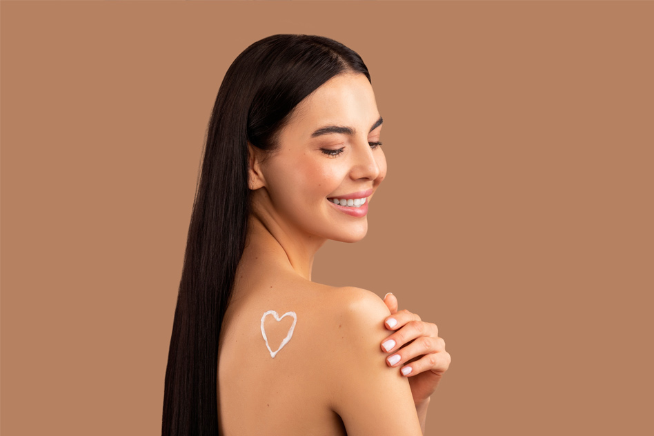 Banner including a woman's profile and her shoulder with heart shaped cream on it.