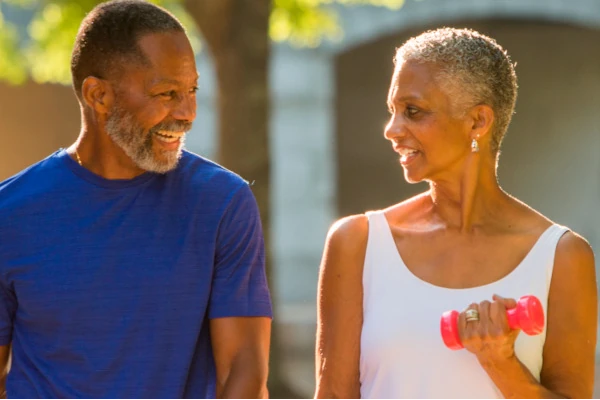 A man and woman exercising outdoors