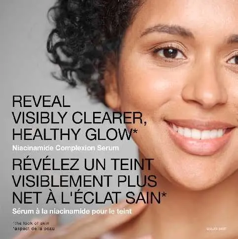 A woman smiling with the text 'reveal visibly clearer, healthy glow'