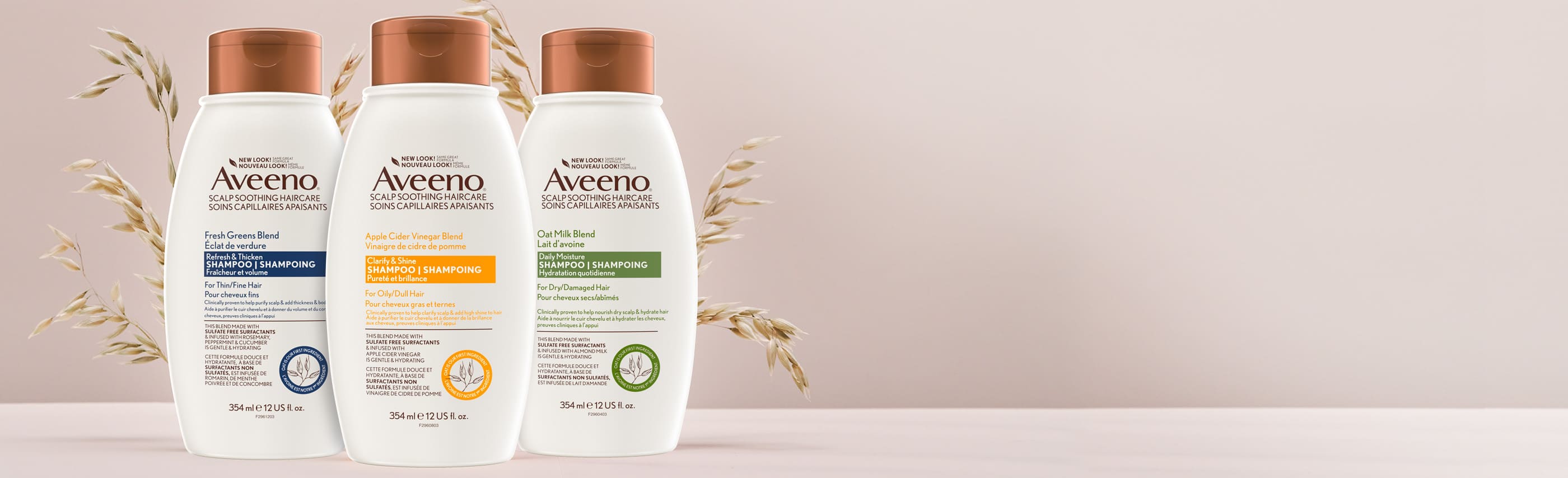 Bannière incluant trois flacons de 354 ml des shampoings AVEENO® Éclat de verdure, Vinaigre de cidre de pomme et Lait d’avoine.