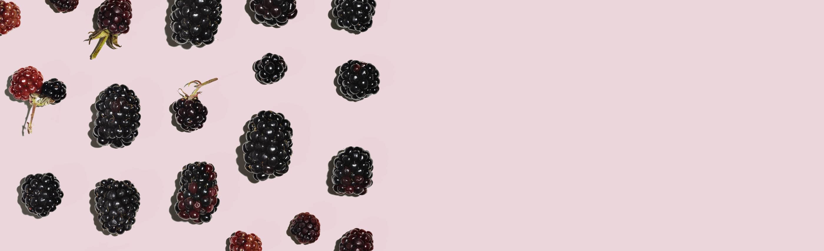 berries grid against a pink background