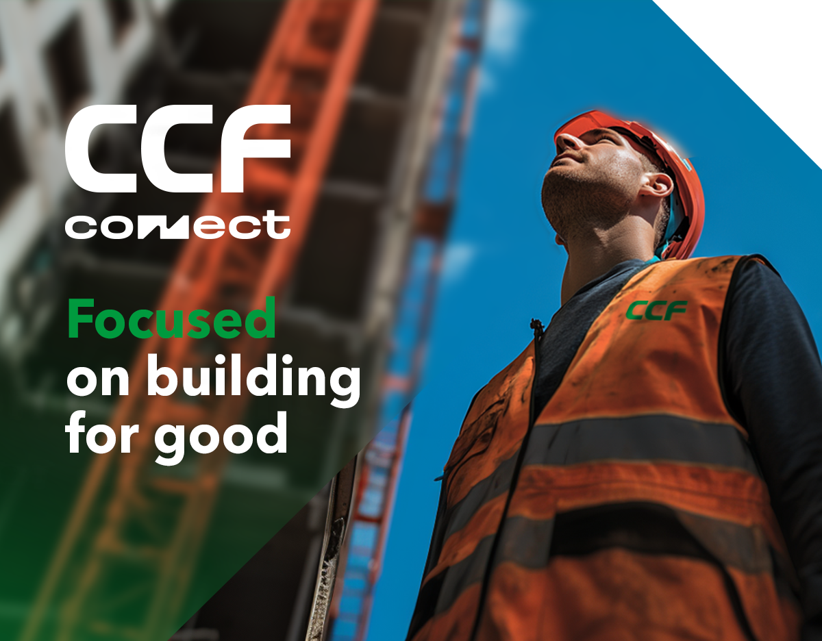 A CCF employee on site looking up at construction of high-rise