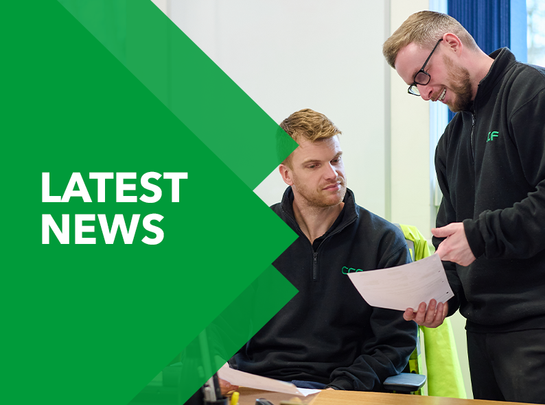 Two CCF employees chatting and smiling and the image reads latest news.